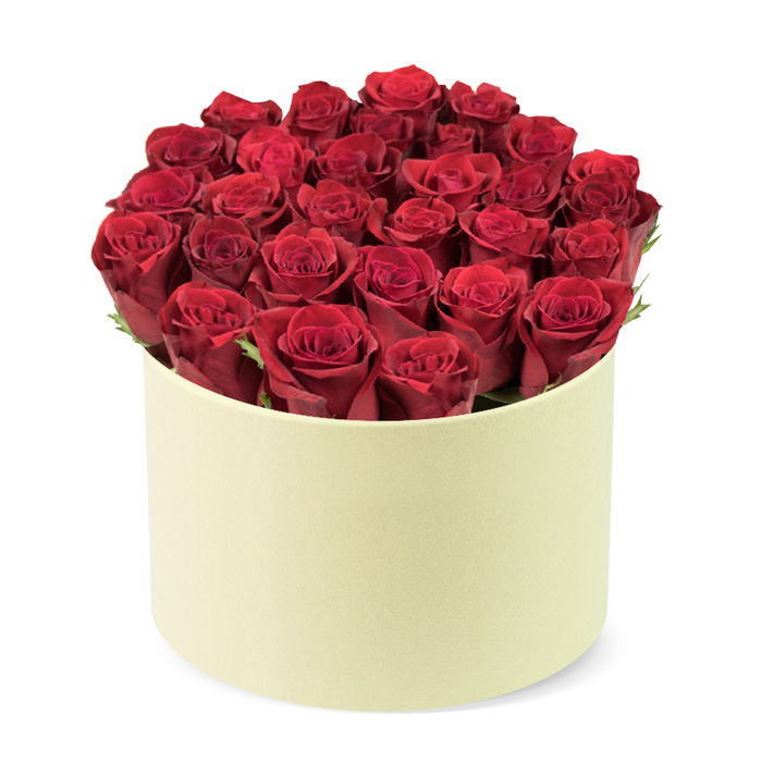 On a clean white stage sits a striking, round ivory box housing a lush barrage of crimson roses approximately two dozen-each bloom with tightly furled petals that speak of fresh harvest and prime form. The velvet petals form a dense dome that rises above the pale container, while discreet green foliage peeks between the heads, giving life and breath to the bouquet. The box's matte finish reads softly luxurious, a modern hat-box homage that our Brent Cross shop often favors for premium deliveries from the area around the Brent Cross Shopping Centre. The entire scene is captured from a slightly elevated, three-quarter angle, centering the arrangement so every curve and petal is visible. Against the pristine white background, the bouquet commands attention as a powerful token of love, romance, or celebration. This is a gift designed to mark anniversaries, Valentines Day, or a grand gesture of appreciation, available for delivery across Brent Cross and surrounding NW postcodes. The craftsmanship is evident in the careful placement of each stem, balancing colour, texture, and form to resonate with our local community's taste for refined floral design. The soft lighting highlights the velvet texture of the petals and the subtle sheen of the creamy box, while the green accents provide a fresh, natural note. Set in a home or boutique setting nearby Brent Cross, this arrangement feels ready to brighten a dining table or an entryway. It's the kind of gift that pairs well with a handwritten card and a thoughtful delivery to Golders Green, Cricklewood, or Hendon, reinforcing the sense of lasting appreciation that our neighbourhood values.