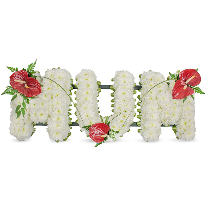 A tender and meticulously arranged sympathy tribute spells the word MUM in refined capital letters, each letter entirely covered in tightly packed, pristine white spray chrysanthemums that give the surface a plush, uniform texture. The chrysanthemums read as soft and quiet, their pale petals catching soft daylight to create a serene, almost luminous field against a plain white background. Three striking red anthuriums provide the arrangement's focal punctuation: one placed on the upper left of the first M, a second nestled at the curve of the U, and a third adorning the upper right of the final M. Each anthurium's glossy, waxy spathe and pale yellow spadix stand in poignant contrast to the white blooms, and small clusters of deep green foliage-delicate fern fronds and broader leaves-surround the red blooms to add depth and a woodland coolness. Slender, arching green stems or blades of grass link the three red accents, creating graceful movement across the letters and unifying the composition. A discreet dark green support frame is visible at the perimeters, giving the freestanding letters their crisp outline and structural integrity. Designed for memorial services, wakes, or a graveside tribute around Brent Reservoir (Welsh Harp), Hendon or nearby Church End, this classic arrangement offers a visual language of respect, enduring affection and gentle consolation, crafted to communicate the warmth of memory as well as the quiet of farewell.