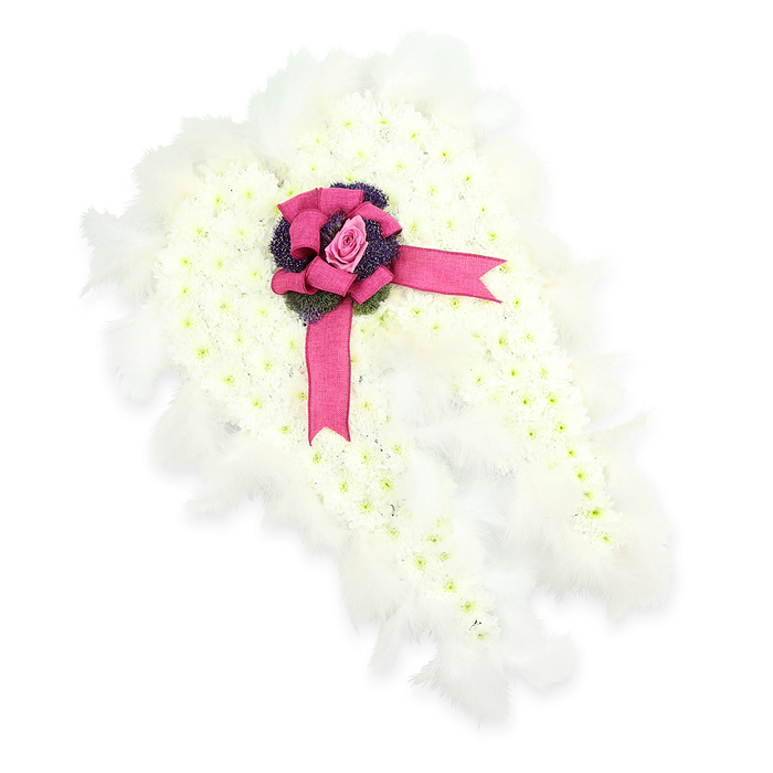 A beautifully detailed angel wings floral tribute fills this scene, the entire design set against a stark white backdrop to emphasise every carefully considered element. Each wing is shaped from a thick carpet of small, pristine white chrysanthemums arranged in dense clusters. Their petals overlap like tiny, soft scales of snow, creating a velvety, cloud-like texture across the wings' surface. Faint hints of green at the heart of each blossom add subtle variation, preventing the white from feeling flat and instead infusing it with a sense of living freshness, as if freshly delivered from a florist's studio near the busy Brent Cross shopping area. Around the edges of the wings, wisps of white feathers are arranged in a continuous border. These feathers extend just beyond the flowers, gently softening the outline and giving the impression of real angel wings at rest, full of quiet grace and protection. At the centre, where the two wings meet, a bold fuchsia-pink satin bow provides a vivid focal point. Its loops are plush and polished, while its ribbon tails drape elegantly across the flowers below. Resting in the very centre of the bow is a single pink rosebud, its petals still mostly closed, symbolising pure love, unspoken words, and memories kept close to the heart. Beneath the rose, a pocket of deep violet thistle-like blooms or textured foliage adds a darker tone and intricate detail, anchoring the airy white design. This thoughtful combination of colour, texture, and form creates a moving expression of sympathy, well suited for funerals and memorial services in and around Brent Cross, where families seek a gentle, heavenly symbol of farewell.