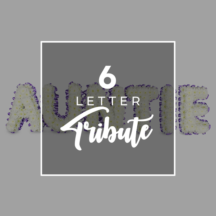 Spelling AUNTIE in six freestanding letters, this tribute from Brent Cross Flowers sits against a soft gray backdrop. Each letter is built from a dense, pure white chrysanthemums cluster, giving a plush, cloud-like surface. A defined purple trim traces the edges, beautifully outlined, with smaller accent blooms that add a regal line of color. A centered white plaque overlays the composition, reading '6 LETTER' in a crisp sans-serif, with 'Tribute' in elegant script beneath. The overall effect is a timeless, deeply respectful memorial that balances loss with gratitude. The arrangement reads as both a personal message and a work of craft, designed to be displayed at services or home altars. The blossoms' scent is light and clean, lifting softly in a quiet space as if memory itself were blooming. Brent Cross Flowers has designed this to feel intimate yet dignified, a piece that families in Hendon, Cricklewood, and Golders Green may hire for a loved one's service. We can deliver across NW4, fresh each morning, and set the letters to stand firmly on a simple pedestal or low stand to keep their shape. The result is a lasting impression-a present, a memory, and a heartfelt goodbye rendered in white with a purple edge. Its clean silhouette catches the eye even in a busy chapel, offering a focal point for quiet conversations after the service and a comforting moment for relatives as they share stories of Auntie's life.