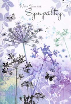 The artistry of this sympathy card rests in its delicately painted, nature-inspired meadow, reminiscent of a quiet, early morning haze over the edges of Brent Cross before the roads grow busy. Fine, threadlike stems of umbelliferous flowers rise from the base of the design, each topped with clusters of tiny blooms that fan out like lacework umbrellas. They're rendered in soft violets, misty blues, and gentle tones of lavender that blend into a background of pale purple and cool, silvery green washes, as though the colours have been breathed onto the paper with watercolour softness. The flowers seem to hover rather than stand rigid, their outlines fading at the edges, which gives them an ethereal, almost dreamlike presence. Among the floating blooms, faintly drawn butterflies drift on invisible currents of air, their translucent wings just catching enough pigment to be seen but never dominating the composition. This interplay between flowers and butterflies creates a sense of quiet movement and delicate life, even in stillness. The mood is one of reflection and calm, offering a visual pause amid the emotion of loss. You can almost imagine running your fingertips over the card and feeling the subtle grain of the paper beneath the gentle sweep of colour. As a florist accustomed to helping families in Brent Cross choose thoughtful ways to express sympathy, I recognise in this design the kind of understated comfort many people seek: a card that doesn't shout, but instead rests softly beside a bouquet or wreath, offering simple, sincere solace and a moment of calm remembrance.