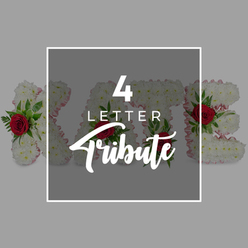 This evocative image presents a personalised four-letter floral tribute, photographed in a calm, neutral setting that echoes the hushed atmosphere of a chapel in Brent Cross on a farewell day. At the centre sits a neat dark grey square, softened with semi-transparency and edged by a slim white border that gives it the feel of an elegant announcement card. Across the square, white text is carefully composed: a bold "4" at the top, the word "LETTER" aligned beneath in a straightforward sans-serif font, and the word "Tribute" flowing at the base in a graceful, script style, adding a note of tenderness to the design. Behind and around this overlay, four sculpted floral letters expand outward to form a name such as "KATE," their shapes easy to read even where the graphic passes over them. Each letter is made entirely from a dense covering of small, pristine white chrysanthemums, their petals folded tightly together to produce a soft yet structured texture reminiscent of fine lacework or cushioned fabric. Peeking from the side surfaces, a narrow trim of pale pink ribbon subtly outlines the contours, offering a gentle contrast that suggests affection and care. Within the white flowers, deep red roses bloom at chosen points, their velvety whorls of petals framed by little clouds of dark green foliage, bringing dramatic colour and emotional depth that naturally draws the eye. The soft grey background behind everything keeps the mood quiet and reflective, ensuring that nothing distracts from the message of remembrance. This image clearly illustrates the concept of customisable letter tributes and name arrangements, ideal for families in Brent Cross who wish to commemorate a loved one with an individual word or name created from fresh flowers for services in local churches, crematoria, or family gatherings at home.