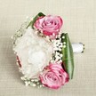 On a softly woven linen canvas, this romantic bouquet tells the story of Brent Cross's special occasions and neighbourhood charm. Three radiant pink roses, each petal softly glazed from bright magenta edges to pale, blush-pink centers, nestle close in gentle harmony, their mood both joyful and hopeful. Cradled amongst them, a single white peony blooms in extravagance-its ruffled, tissue-thin petals unfolding in creamy abundance, reminiscent of festive gatherings in Brent Cross's parks or the excitement of springtime. Intertwined throughout are airy sprigs of baby's breath, each tiny star-shaped flower adding a sense of frothy lightness and delicate grace to the ensemble. Encasing the blooms, deep emerald green leaves provide an elegant frame, their polished texture and structure enhancing the vividness of the white and pink palette. The bouquet is expertly bound by a smooth, shining white satin ribbon, its neat finish ready for a bridal procession or cherished as a romantic gift. With soft, even lighting bringing out every intricate detail, this bouquet comes to life as a sensory celebration-a gentle fragrance imagined and a visual caress crafted by Brent Cross Flowers. Whether marking a wedding, an anniversary, or a joyful milestone, this arrangement is a true embrace of beauty and emotion, woven together with local expertise for the Brent Cross community.