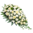 A dignified white funeral flower spray extends diagonally over a clean white background, its classic teardrop shape clearly defined from the lush fullness of the upper left through to the slender taper at the lower right. The arrangement is composed primarily of white and cream roses, carefully layered to create a sense of fullness and quiet luxury. Some roses appear newly opened, with tightly cupped petals, while others are more relaxed, showing their spiral centres and soft, rounded edges. Interspersed among the roses are delicate white carnations, their frilled petals adding a textured softness that balances the smoothness of the rose blooms. Beneath and around the flowers, a bed of rich green foliage forms a supportive base. Darker green leaves lend structure, while eucalyptus in a muted, silvery green tone weaves gently through the composition, adding coolness and calm. At the tapered end, trailing greenery stretches outward, enhancing the impression of gentle movement and drawing the eye along the arrangement's length. The lighting is soft and evenly distributed, so every petal and leaf appears clear yet understated, contributing to the overall atmosphere of serenity. This is the sort of sympathy spray one might see at a service in Brent Cross or nearby Cricklewood, where families gather to remember loved ones with grace and restraint. Subtle and respectful, the mix of white flowers and green foliage communicates condolence, reverence, and hope, offering a quiet, beautiful presence beside a coffin, on a stand by the altar, or at a memorial gathering in the Brent Cross area.