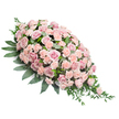 Presented on a clean white surface, this elegant sympathy spray appears as a soft, flowing teardrop of pink petals and green leaves. The design starts with a full, rounded crown of blooms at the upper left and gently narrows towards a delicate, pointed tip at the lower right, creating a sense of movement and direction. At the heart of the arrangement are numerous blush pink and light peach-pink roses, packed closely together for a rich, luxurious look. Some roses are fully open, revealing beautifully layered centres, while others remain in tighter buds that suggest tenderness and quiet reflection. Throughout the body of the spray, pastel carnations are interspersed among the roses, their ruffled petals adding texture and volume so the whole tribute feels cushioned and soft to the eye. Supporting this sea of pink blooms is a base of deep green foliage. Broad, darker leaves form a steady foundation, framing the flowers and helping them stand out, while finer, more elongated stems and sprigs extend beyond the main outline, particularly along the trailing end, where they lend a natural, slightly cascading finish. The colour harmony between the pale pinks and lush greens gives the spray a serene, comforting character, ideal for a funeral or memorial service. One might imagine it resting atop a coffin during a service near Brent Cross, overlooking familiar streets and parks, offering a visual symbol of love and farewell. Thoughtfully designed to lie flat, this floral piece conveys compassion and respect, reflecting the care and sensitivity of the local Brent Cross florists who crafted it.