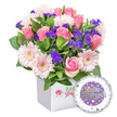 From Brent Cross's leafy corridors and the buzzing NW London scene, this vibrant engagement bouquet arrives in a pristine square white presentation box, a modern keepsake ready to toast a couple's new chapter. Inside, a bountiful mix of soft pink roses rises in elegant, classic form, their petals unfolding in creamy spirals that whisper romance. Interwoven among the roses are pastel pink gerbera daisies, their radiating petals trimmed with crisp white edges and bright pale-yellow centers, catching the eye with cheerful brightness. Sprinklings of deep purple filler flowers-statice-like in charm-offer surprising depth and a touch of drama, while generous green foliage threads through the arrangement, lending a fresh, garden-bright backdrop. The box front carries a discreet, stylized red rose emblem beside lush green branding, a quiet nod to trusted local craft without shouting its name. In the bottom right corner sits a round foil balloon, the centerpiece of the moment: a glossy purple circle framing the words You're Engaged! in shimmering silver lettering, with a gleaming golden ring forming the letter O, a playful and meaningful wink at the proposal. The outer white rim of the balloon is speckled with tiny hearts in pink, blue, purple, and grey and dotted with tiny silver stars, heightening the celebratory mood. This elegant set makes a perfect congratulatory gift for a newly engaged couple, especially when delivered across Brent Cross, Cricklewood, Golders Green, and Hendon, bringing brightness, romance, and hopeful beginnings into any home near the area.
