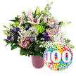 On a clean white background, a jubilant flower arrangement and a festive balloon come together to honour a remarkable 100-year milestone in Brent Cross. The bouquet is gathered in a simple yet stylish matte pink vase, its ribbed surface adding subtle vertical lines that complement the natural stems inside. From this base, a profusion of blooms rises in a soft, harmonious palette. Light pink Oriental lilies form the focal point, some flowers fully open with wide, star-like petals and protruding stamens, while others remain as graceful buds just beginning to show colour. Clustered around the lilies are roses in gentle blush and deeper mauve or dusty rose shades, their velvety petals neatly layered to create a plush, romantic effect. Deep purple lisianthus thread their way between these roses, bringing a richer, velvety tone and slightly ruffled texture. Tiny lavender asters, each with a bright yellow centre, appear here and there, adding a dainty, garden-inspired quality reminiscent of local North London green spaces. Bright lime green button chrysanthemums, rounded and tightly petalled, offer a playful contrast that brightens the mix. Delicate sprays of white baby's breath drift through the arrangement, giving it a soft, airy feel, while a generous collar of dark green foliage frames and supports the blooms, reinforcing the overall lushness. To the right, a glossy, round foil balloon overlaps the bouquet slightly. Its entire surface is patterned with vivid confetti dots in red, orange, yellow, green, blue, and purple, and at the centre, the number '100' appears in large, bold white numerals with a gentle shadow for depth. The pairing of flowers and balloon creates an image of heartfelt celebration, ideally suited to a 100th birthday or centenary anniversary celebrated near Brent Cross Shopping Centre or along the nearby residential streets.