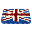 A carefully constructed floral Union Jack fills the frame, its rectangular form and balanced proportions giving it a strong, ceremonial presence. At its base lies a dense expanse of deep blue chrysanthemums, their small, rounded petals pressed close together so that the colour reads as a rich, velvety backdrop. Across this blue field, pristine white flowers carve out the vertical and horizontal cross of England, the lines perfectly straight, their soft, cushion-like texture lending a gentle, consoling note to the design. Diagonally, bands of vibrant red blossoms sweep through, each stripe sharply outlined with slim rows of white petals that preserve the precise detailing of St Patrick's Cross. The arrangement has a slight dome, so the flag appears to rise gently from the board, creating a subtle three-dimensional effect, as though it is a padded floral flag resting at peace. Along the lower edge, a neatly pleated satin-effect ribbon in matching blue forms a tidy border, completing the tribute with a sense of polish and ceremony. One can picture this arrangement travelling quietly through Brent Cross, perhaps en route to a service near the North Circular or a chapel close to Brent Cross station, ready to be placed beside a coffin or at the front of a service. The combination of bold patriotic colours, soft textures, and the hushed scent of fresh blooms creates an atmosphere of respect and remembrance, offering families a tangible way to express gratitude, pride, and love for someone whose life was closely tied to British identity.