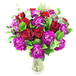 A lush, hand-arranged bouquet captured against a clean white backdrop: deep, velvety red roses sit at the heart of the design, some tightly furled like secret notes and others breathing open to reveal layered, satin petals. Scattered among them are ruffled carnations in an intense magenta-purple, their frilly edges catching light and adding a playful, textural counterpoint to the roses' smooth curves. The composition is generously layered with glossy green foliage - long, verdant ruscus leaves offer structure and shine while softer, silvery eucalyptus sprigs bring a cool, modern lift and a faint aromatic thread. The stems are visible through a simple clear glass vase, the vertical lines of the stems contrasting with the rounded, abundant cluster of blooms and reinforcing a fresh, garden-picked quality. In gentle studio light the reds and purples glow with depth, the greens providing a dewy backdrop that makes each bloom pop. This arrangement reads as both classic and contemporary: romantic yet spirited, perfect for marking anniversaries, birthdays, or moments when you want to send encouragement from nearby Cricklewood to Brent Cross Shopping Centre. As a local florist would say, the scent would be quietly floral with a hint of eucalyptus freshness, and the careful placement of each flower shows an experienced hand in balancing colour, form and texture. Designed to sit proudly on a dining table or console, the bouquet feels generous and celebratory without being fussy - an elegant, thoughtful floral gift that brings warmth and brightness to any room or delivery in the Brent Cross area.
