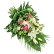 Infused with both comfort and grace, this funeral flower spray captures a moment of serene contemplation, thoughtfully arranged by Brent Cross florists. At the heart lie majestic white lilies, their open blooms softly gleaming with golden centers, interspersed with gracefully curled buds. Blushed pink roses unwind beside them, offering gentle echoes of love and memory, while clusters of ruffled white spray carnations add texture and the quiet promise of hope. Spheres of bright green santini chrysanthemums provide a joyous, tactile counterpoint, evoking the green vitality of Clitterhouse Playing Fields in early spring. Red hypericum berries, glossy and bold, are carefully placed as uplifting highlights. Expanses of diverse green foliage-from folded tropical leaves to graceful, slender palm fronds-create depth, frame each blossom, and guide the eye down the gentle, diagonal cascade. Subtle natural lighting enhances every detail, casting soft highlights along glossy leaves and luminous petals. This bouquet offers a sympathetic embrace and a heartfelt presence, perfectly suited for marking funerals or special remembrance occasions across Brent Cross and neighbouring communities, with same-day delivery available from local floral experts.