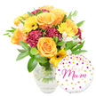 A vibrant, celebratory gift set is arranged against a crisp white background: a lush bouquet sits slightly centre-left in a clear glass vase while a round white foil balloon nestles to the lower right. The bouquet radiates warm, sunlit tones - generous, full-petalled roses in glowing orange and sunny yellow unfurl in soft spirals, their velvety texture catching the light. Bright yellow gerbera daisies punctuate the composition with flat, cheerful faces and dark, almost black centres that contrast beautifully with the roses. Deep maroon carnations, ruffled and plush, add a velveteen depth and sculptural volume between the brighter blooms. Delicate white alstroemeria with slender, speckled petals peek through the mix, lending a refined, airy punctuation that lightens the overall palette. A generous cloud of glossy green foliage - broad leaves and slender sprigs - frames the flowers and creates a lush backdrop, while the clear vase reveals neatly trimmed stems and fresh water, a simple honesty that signals recent, careful preparation.

To the lower right, the glossy round balloon is playfully decorated with scattered gold and hot-pink polka dots and tiny heart motifs; across its face the handwritten-style message best Mum appears in flowing hot-pink script, overlapping the base of the vase in a warm, intimate touch. The lighting is soft and even, emphasizing petal sheen and glass reflections without harsh shadow, and the overall effect is quietly celebratory. You can almost smell the sweet, green fragrance of freshly cut roses and the faint, clean scent of foliage. This arrangement - equally suited for Mother's Day, a birthday, or a thank-you - reflects the same hand-tied care local customers expect around Brent Cross shopping centre and the North Circular, promising a bright, thoughtful gift for a beloved mum.